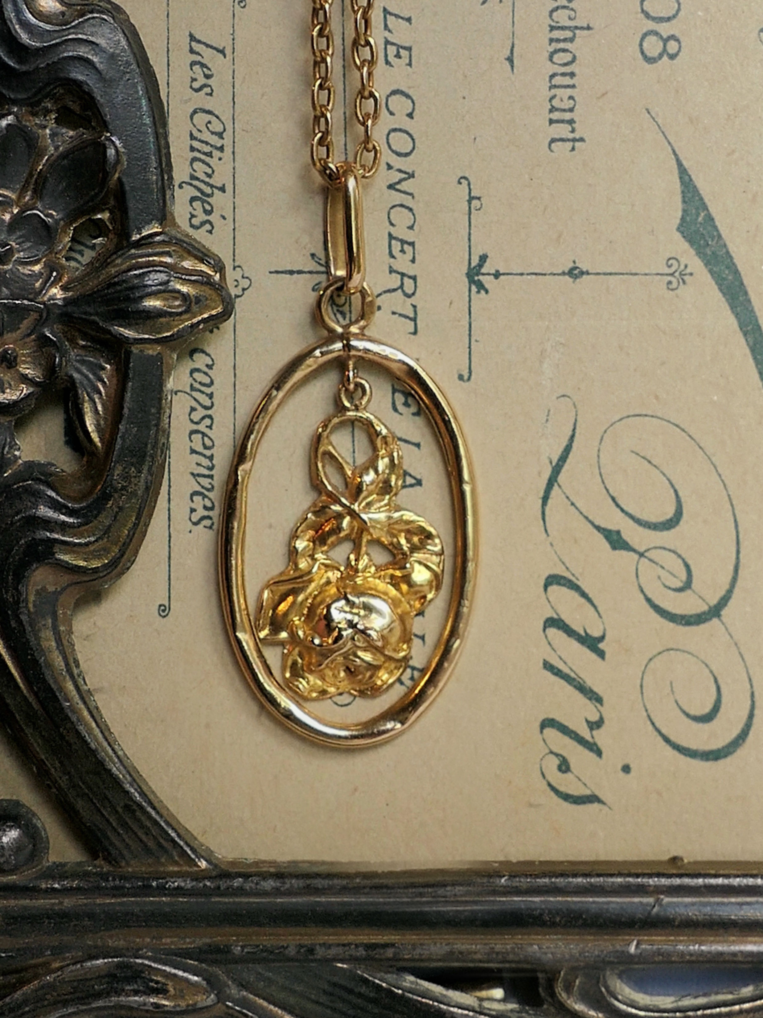 Antique French Articulated Rose Pendant in an Oval Frame