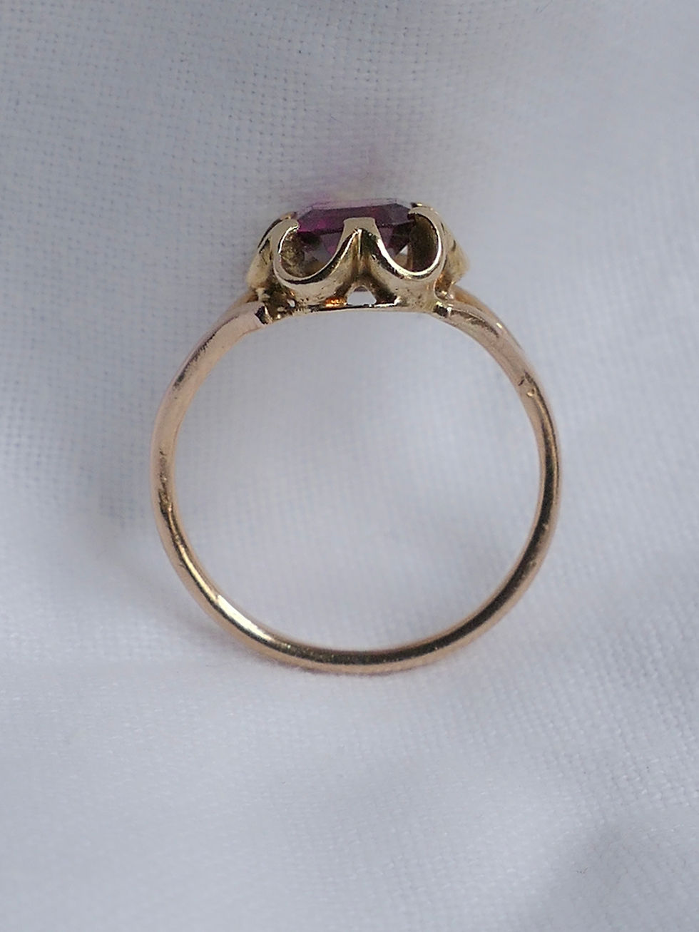 Thumbnail: Antique Ring with an Emerald Cut Garnet in a Buttercup Style Setting