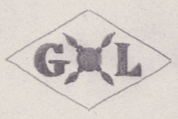 French Maker's Mark
NAME: Gaston Lemaître INITIALS: G L SYMBOL: Bomb with 4 wicks DATES: 1905 - 1922 SPECIALITY: Jeweller PLACE: 5 bis rue du Louvre, Paris, France
