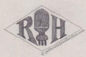 French Maker's Mark
NAME: Henri Riche INITIALS: R H SYMBOL: Lamp DATES: 1927 - SPECIALITY: Jeweller PLACE: 47bis avenue de Clichy, Paris, France