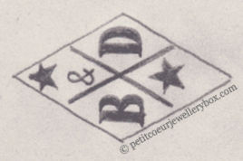 Poinçon de maître orfèvre joaillier, poinçon de fabricant, poinçon d’atelier, poinçon losangique.   NOM:                Charles Blanchin & Joseph Dauvain INITIALES: B & D SYMBOLE:          Croix et 2 étoiles DATES: 1879 - 1880 PROFESSION: Bijoutier ADRESSE: 42 rue aux Ours, Paris, France