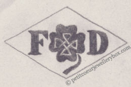 French Maker's Mark
NAME: Frédéric Dufat INITIALS: F D SYMBOL: Decorated clover DATES: 1905 - SPECIALITY: Silversmith PLACE: 3 avenue de l'Opéra, Paris, France
