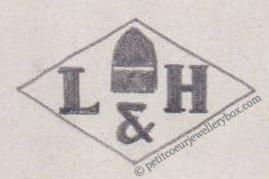 French Maker's Mark
NAME: Lowcay & Henry INITIALS: L & H SYMBOL: Artillery shell DATES: 1921 - SPECIALITY: Jeweller PLACE: 94 rue du Temple, Paris, France