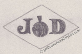 Poinçon de maître orfèvre joaillier, poinçon de fabricant, poinçon d’atelier, poinçon losangique NOM: Jean Dechezelles INITIALES: J D SYMBOLE: Orange DATES: 1940 - PROFESSION: Bijoutier ADRESSE: 4 rue Rossini, Paris, France