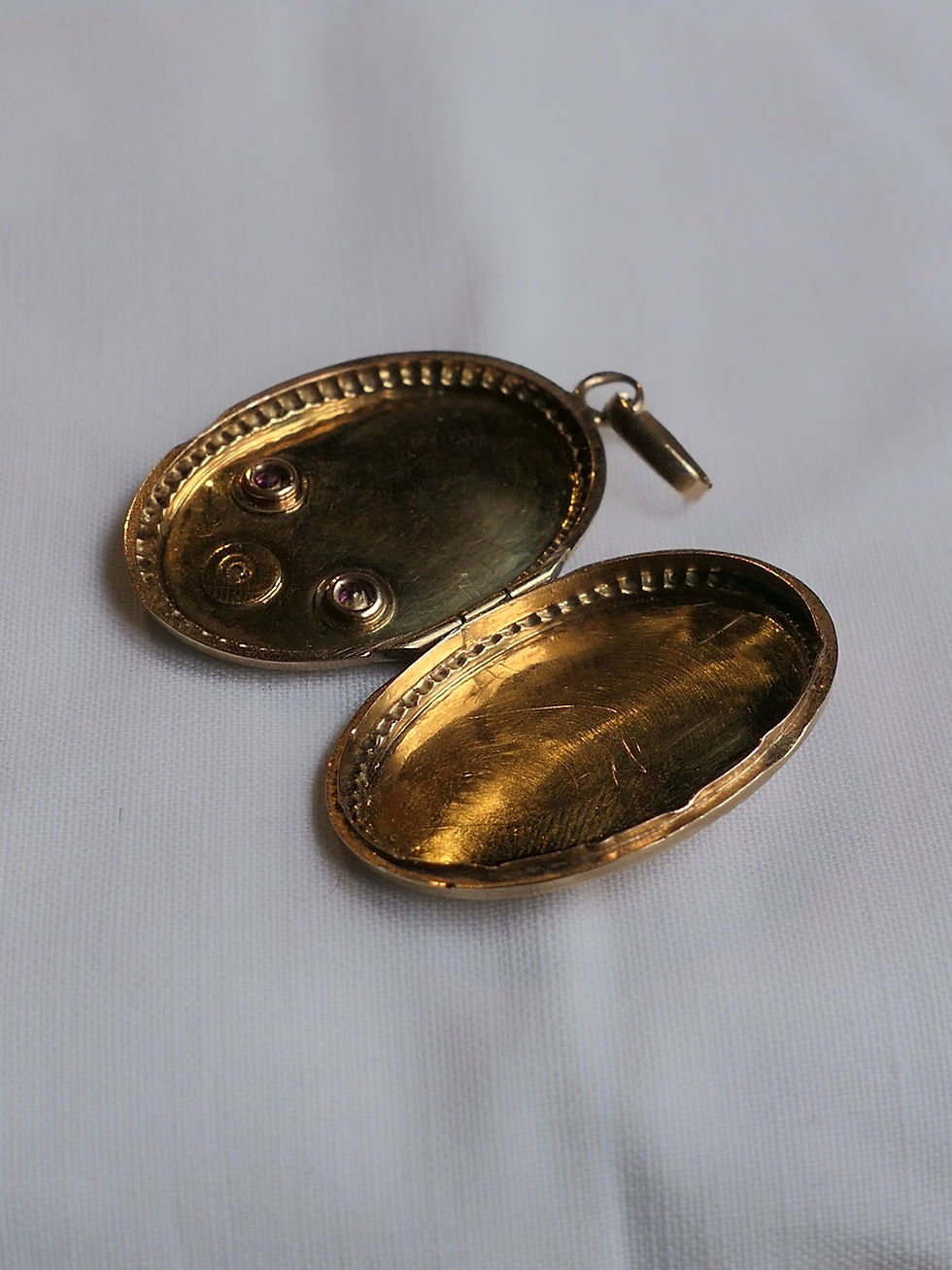 Thumbnail: Antique Locket Decorated with Engraved Bow Ribbon, Garnets and Natural Pearl