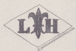 French Maker's Mark
NAME: Loys Houriet INITIALS: L H SYMBOL: Fleur-de-lys DATES: 1920 - 1964 SPECIALITY: Jeweller PLACE: Paris, France