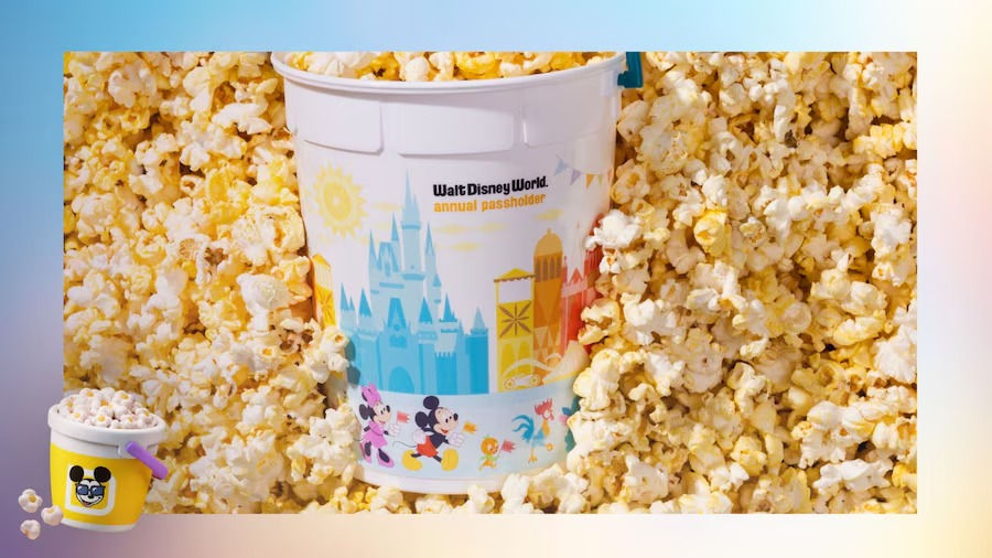 Eye-level view of a colorful popcorn bucket shaped like a classic Disney character