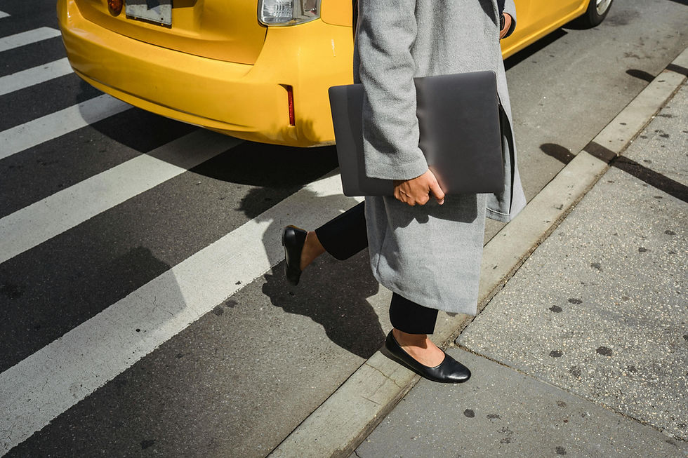 Business woman crossing the street