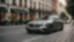 Eye-level view of a luxurious S Class Mercedes on a city street