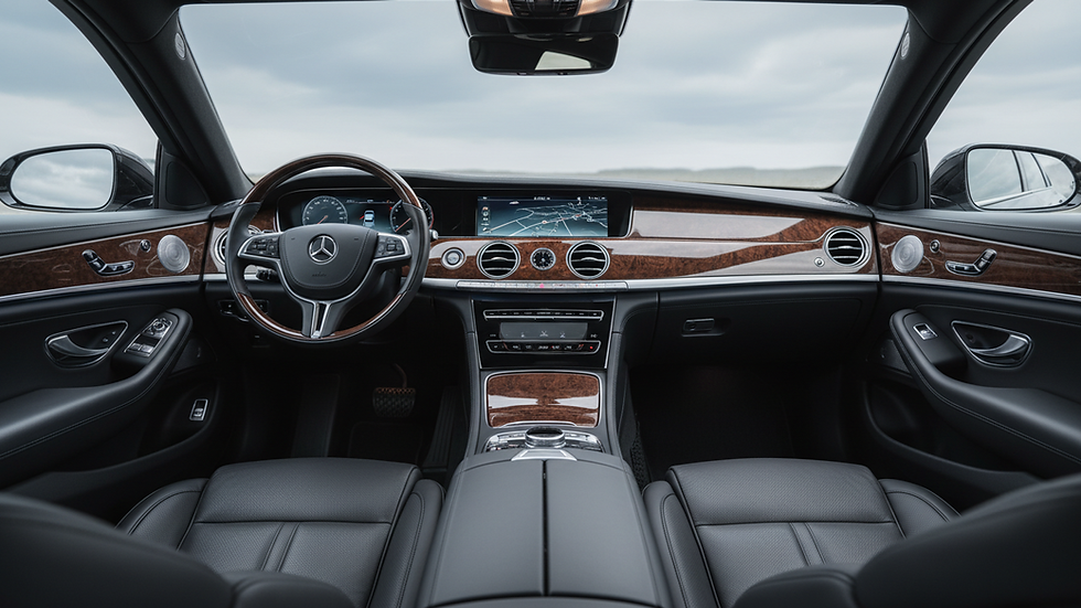 Close-up view of a luxury wedding car interior with leather seats and polished wood