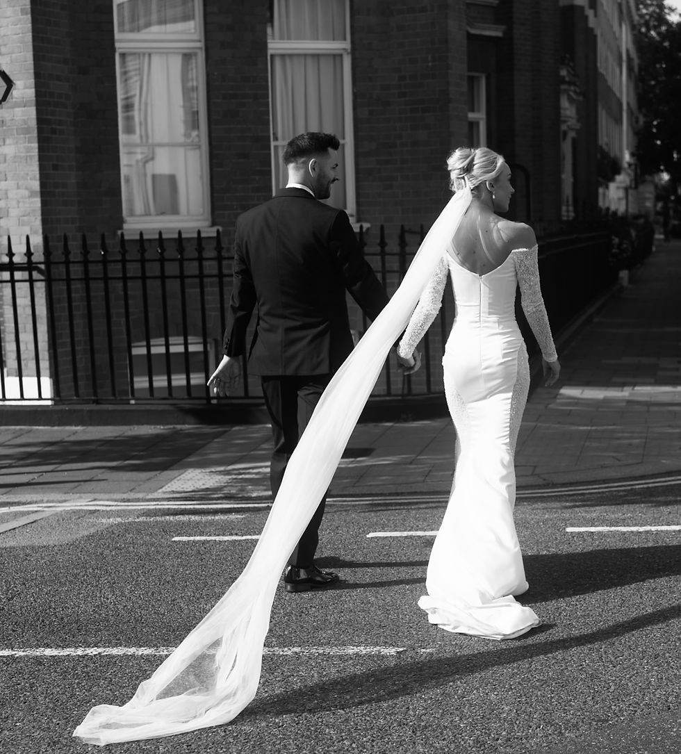 bride and groom crossing the road