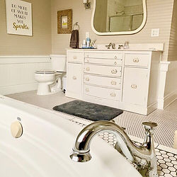 Bathroom interior with vanity, mirror, and bathtub; relaxation concept, home decor.