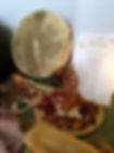 closing the bones altar with drum, woman figure incence holder, poem and rose petals