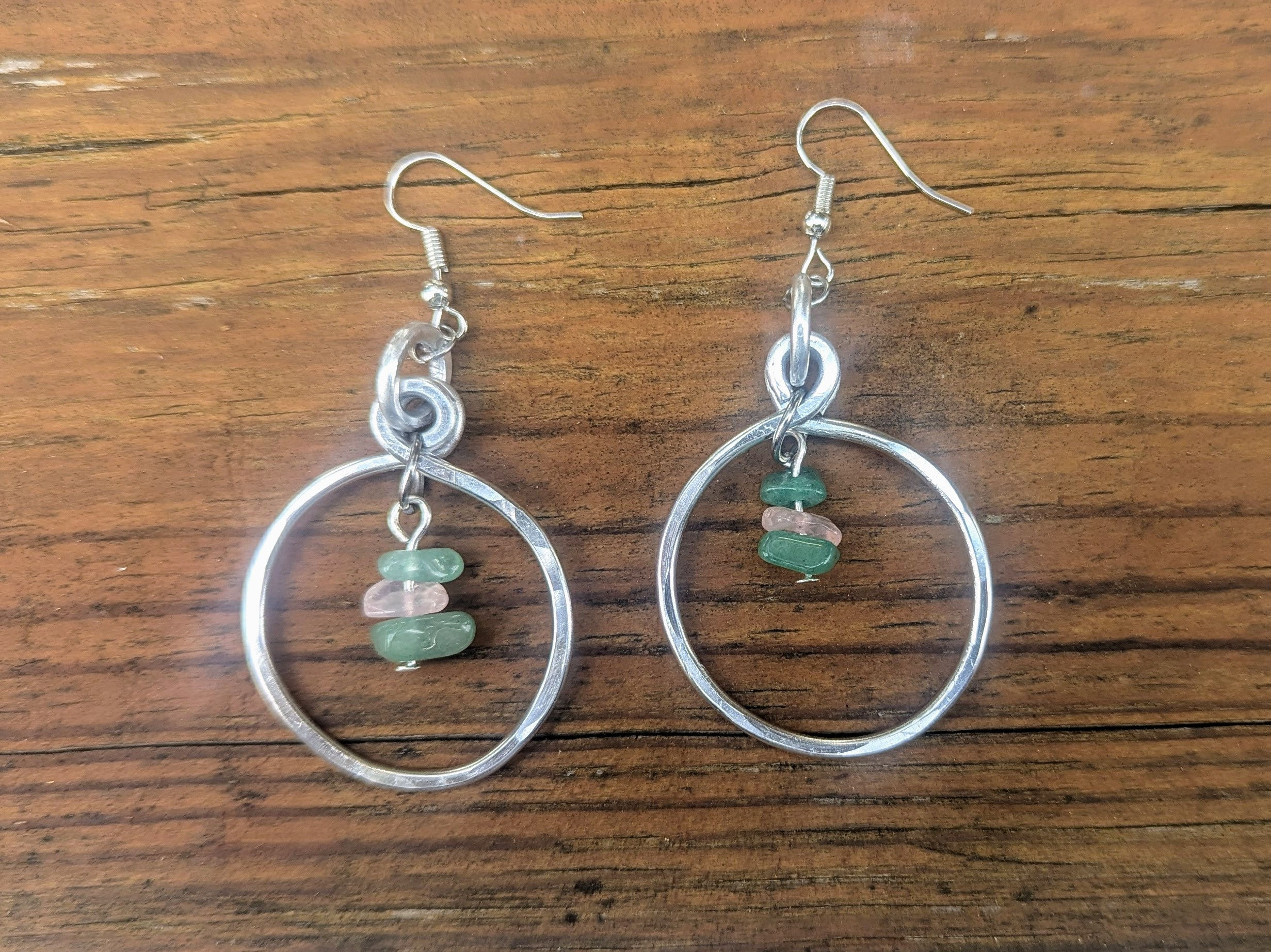 Handmade silver hoop earrings with green stones