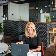 woman smiling with laptop