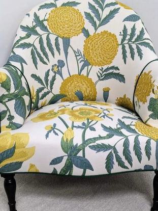 Fanny Shorter natural linen on an upholstered armchair — designer fabric, available through MOTIVO.