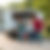 Quick and easy junk removal services, family walks away free from junk as the truck leaves with the last load 