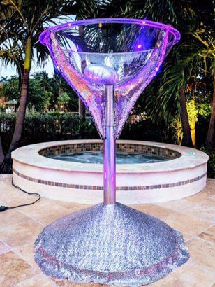 Giant silver martini glass as a centerpiece at a private birthday party event.