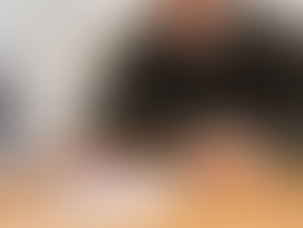 A man signing an official document with a pen, relating to probate.