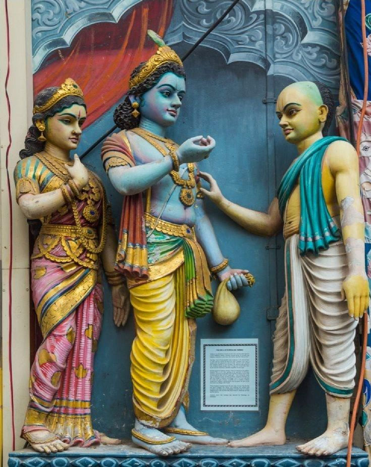 A deity of Krishna and his associates