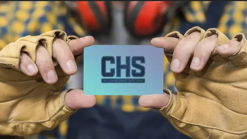a person holding a card that says chs delivering energy excellence