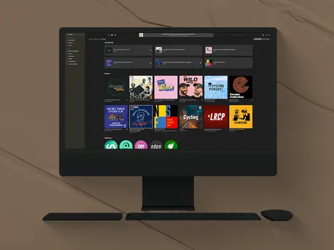 a computer screen shows a cycling podcast