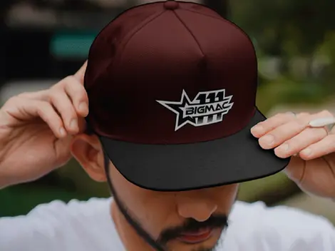 a man wearing a hat that says 111 bigmac on it