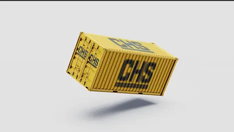 a yellow chs shipping container is floating in the air