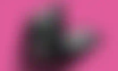 a laptop a phone and a tablet are displayed on a pink background