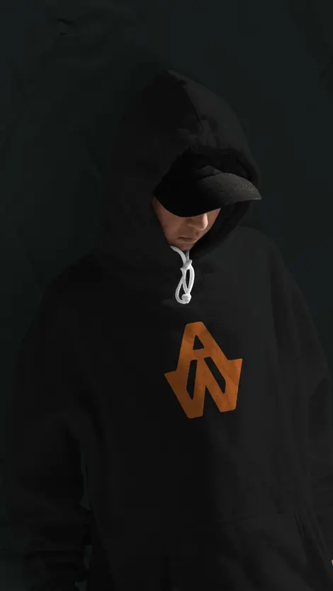 a person wearing a black hoodie with the letters aw on it