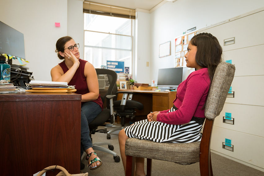 Neysa Nankervis, Staff Attorney works with a young client. 