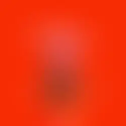 A woman in an orange top excitedly gestures under colorful toys against a bright red background with "Orgasm Tour" text overhead.