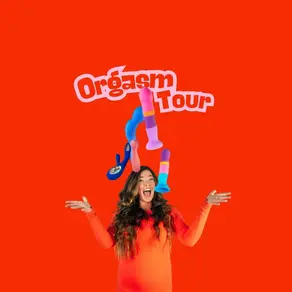 A woman in an orange top excitedly gestures under colorful toys against a bright red background with "Orgasm Tour" text overhead.