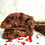 Thumbnail: Vegan Raspberry Double Chocolate NYC Cookie cut in half
