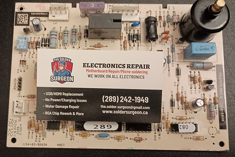A close-up view of a pool heater control board circuit path following a successful motherboard trace reconstruction on the workbench. Precision copper jumper wires are micro-soldered under magnification to bridge damaged sections, permanently restoring electrical continuity across the primary power rail.