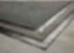 A detailed cross-section showing the redundant layered structure of a built-up modified bitumen roofing system, representing heavy-duty industrial and commercial flat roof protection offered by Central Roofing Inc.