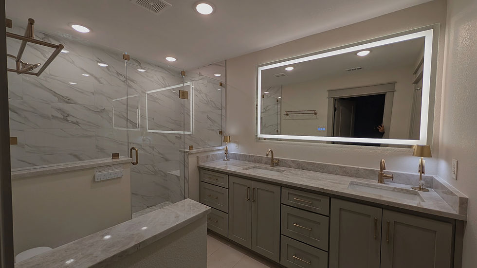 Modern bathroom remodeling in Southlake, Texas featuring frameless glass shower, LED vanity mirror lighting, marble tile walls, luxury bathroom renovation, and custom craftsmanship by Eclipse Custom Homes.