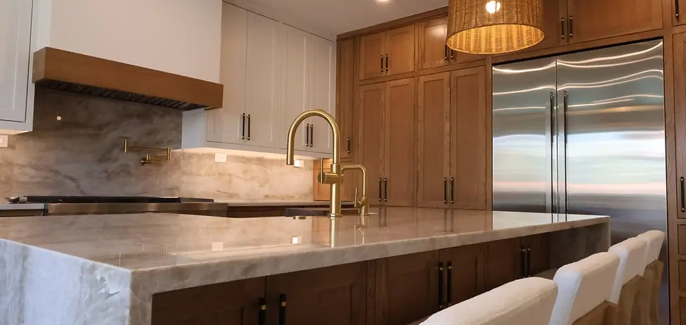 Luxury custom kitchen in Colleyville, Texas featuring hardwood cabinetry, quartz countertops, stainless steel appliances, oversized island seating, and premium kitchen remodeling craftsmanship