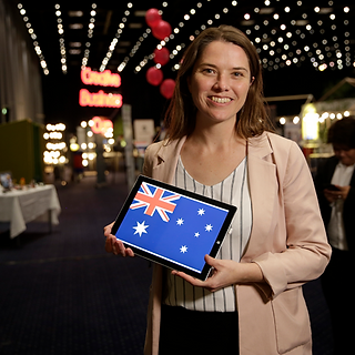 Gemma Pepper holds the Australian flag at the Creative Business Cup.