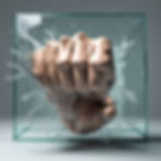 A fist smashing through a pane of glass to symbolise smashing through glass ceiling to higher grades