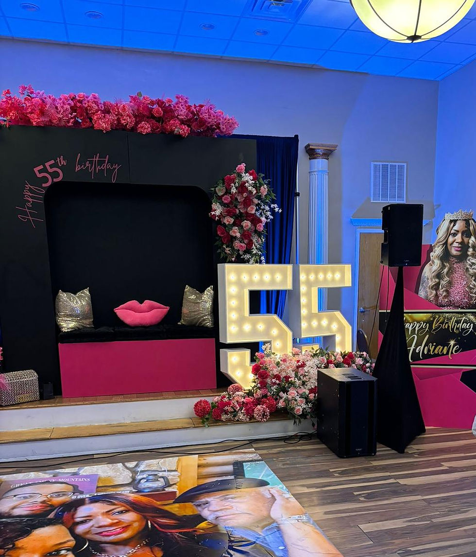 Custom themed event setup with colorful scenic graphics, decorative displays and coordinated party decorations.