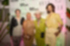 A group of stylishly dressed celebrities and fashion industry professionals pose for a photo at the Elle magazine party during Miami Swim Week®.