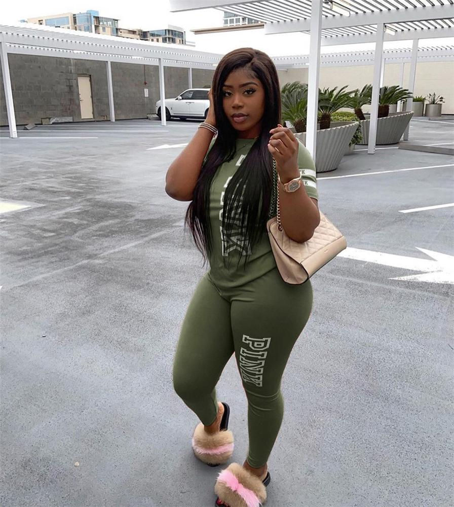 Thumbnail: Woman wearing green jogging sweats set, holding purse, stands outdoors Jogging Sweats Track Suit Sets Tracksuit Pink Sweatsuit for Women