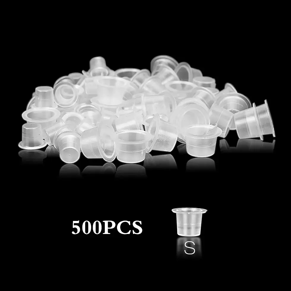 Thumbnail: Pile of 500PCS tattoo ink cups on black surface, The Kingdom Tattoos.