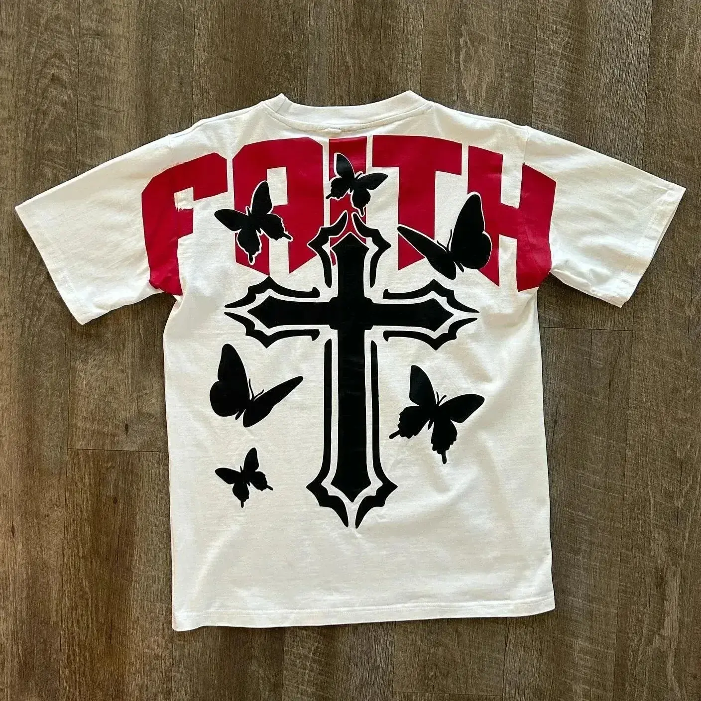 White t-shirt with red 'FAITH' and cross with butterflies The Kingdom Tattoos