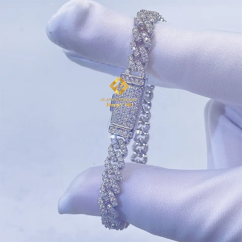 Thumbnail: A hand wearing a white glove holding a diamond bracelet jewelry.