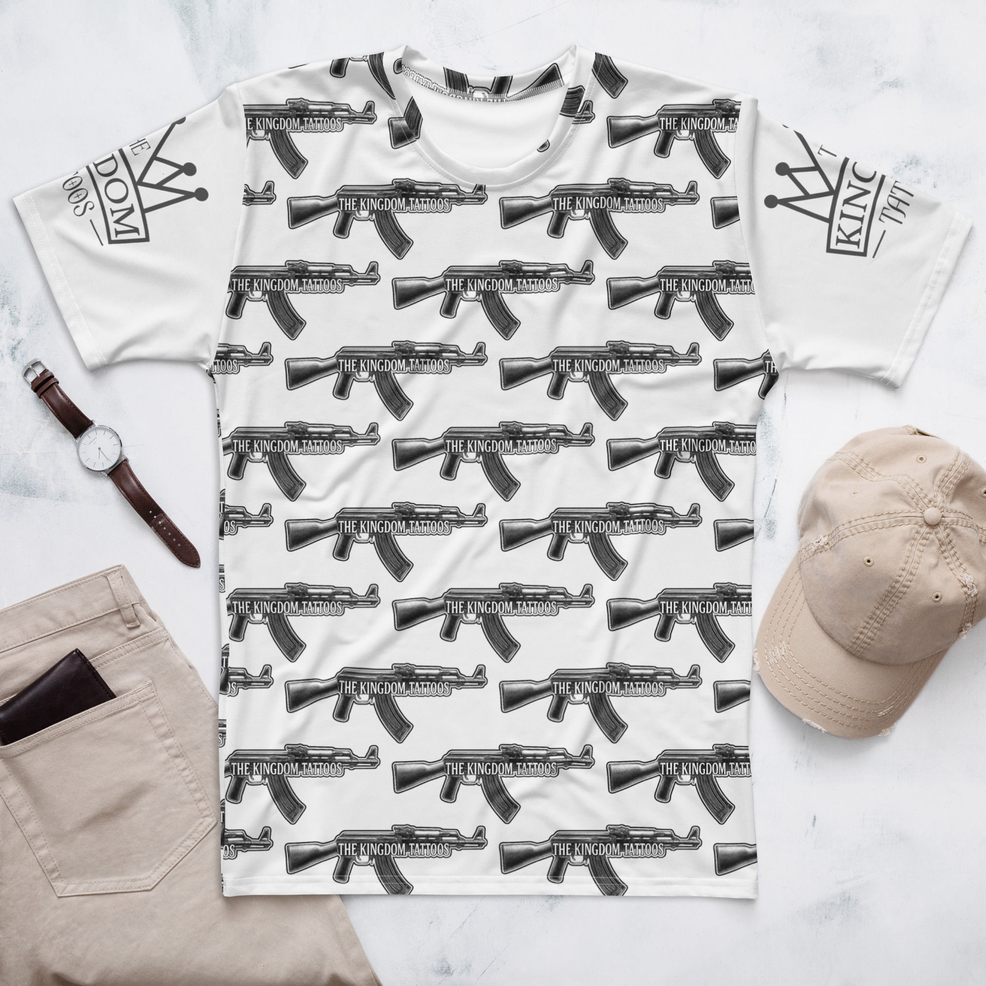 White t-shirt with AK-47 repeating pattern and the text Kingdom Tattoos