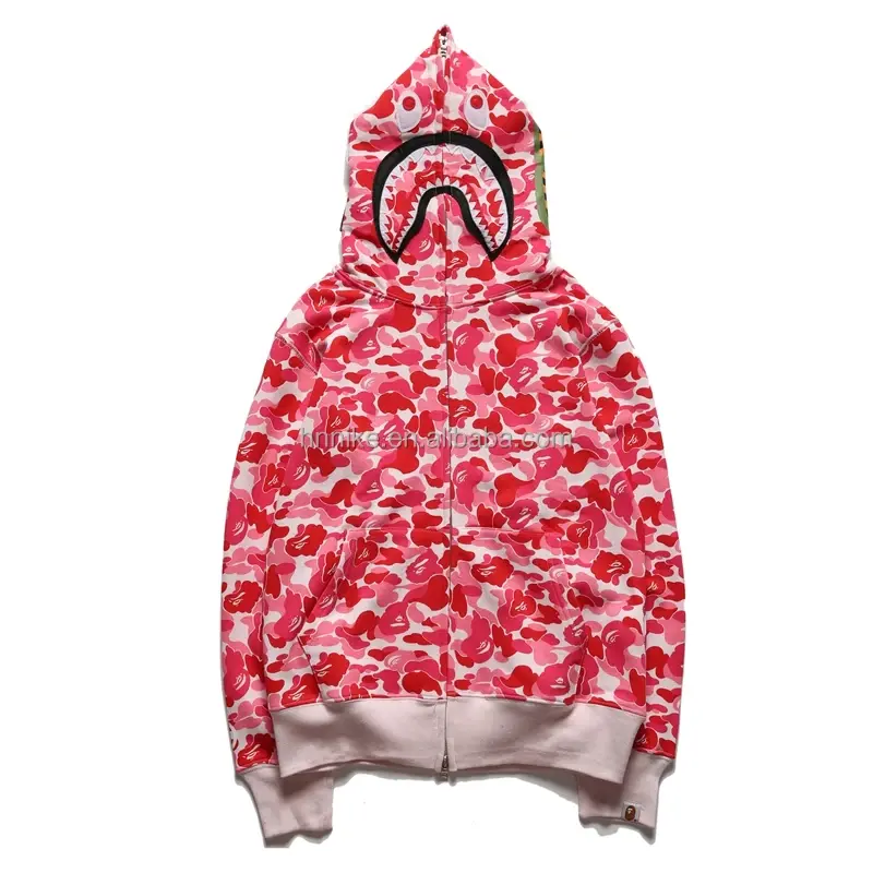 Thumbnail: Pink camouflage BAPE hoodie with shark mouth, white trim and zipper closure.