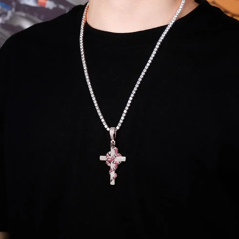 Man wearing diamond cross necklace on a black shirt, The Kingdom Tattoos
