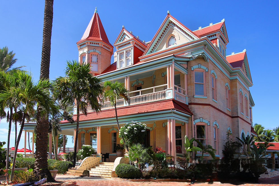 Historic and grand, Mansion on the Sea, formerly known as The Southernmost House stands elegantly by the sea, showcasing its Victorian architecture under a clear blue sky.